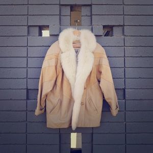 Tan suede jacket with fur lined collar.